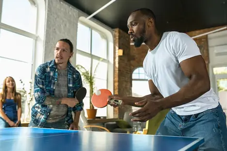 foreiners playing table tennis